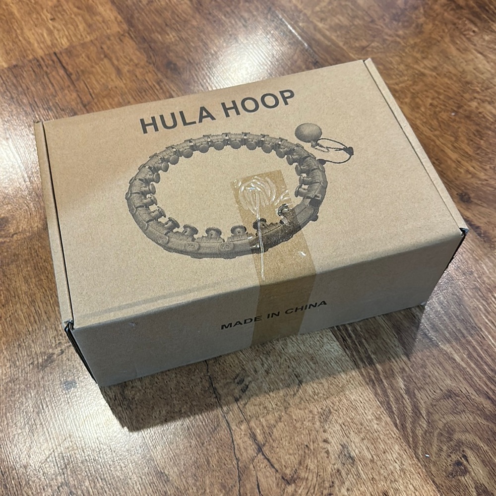 Hula Hoop, With weighted excursive ball. Pink I believe.